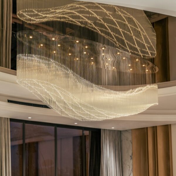 The brand merges fluidity and structure, showcasing a refined approach to lighting design.